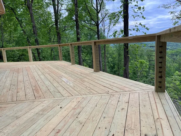 Deck with cable railing looking out over the valley