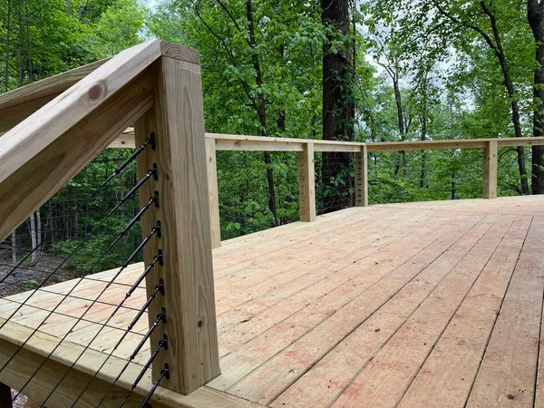 Cable railing post detail on a newly laid deck